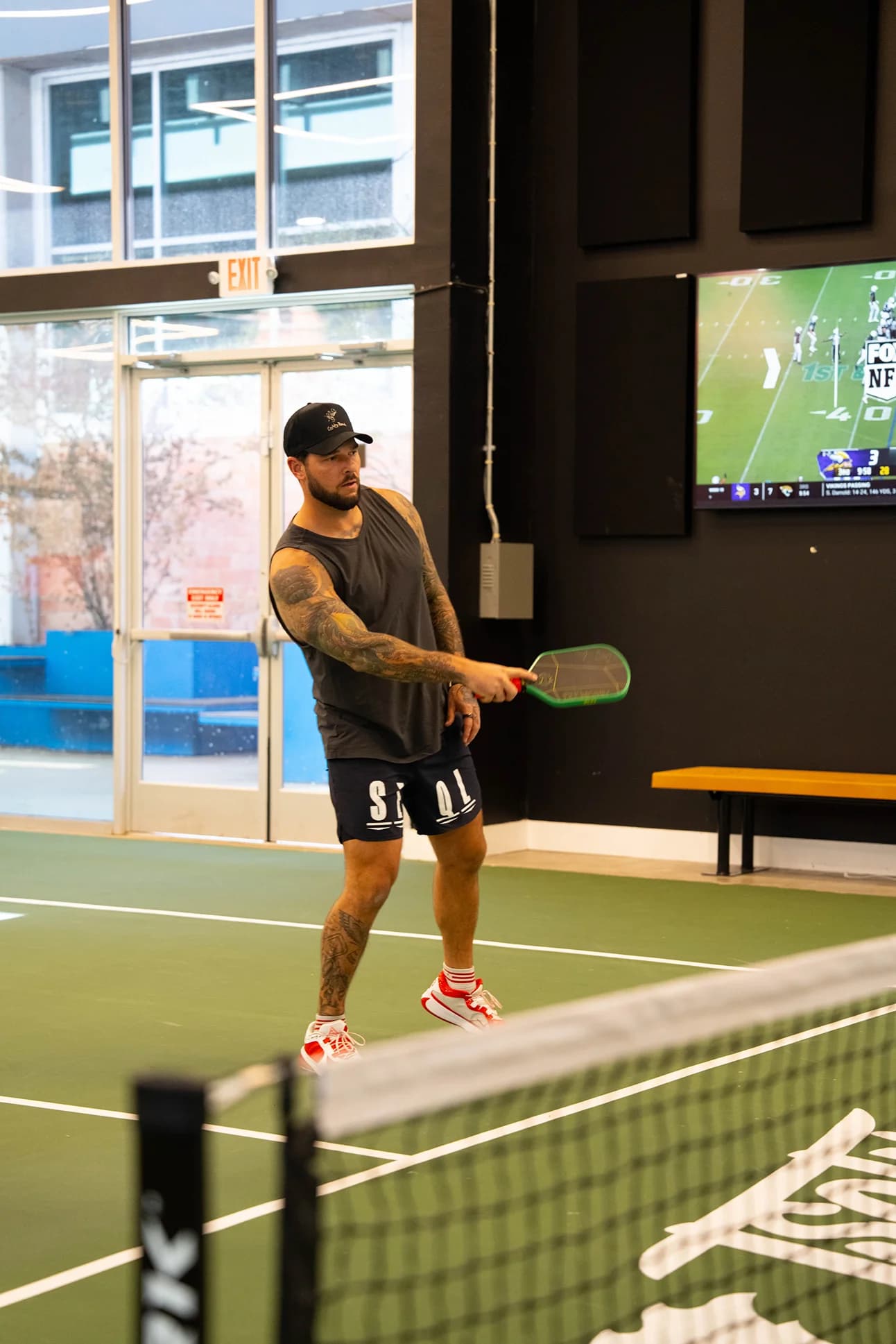 Pickleball doubles team celebrating match point at Sage & Paddle